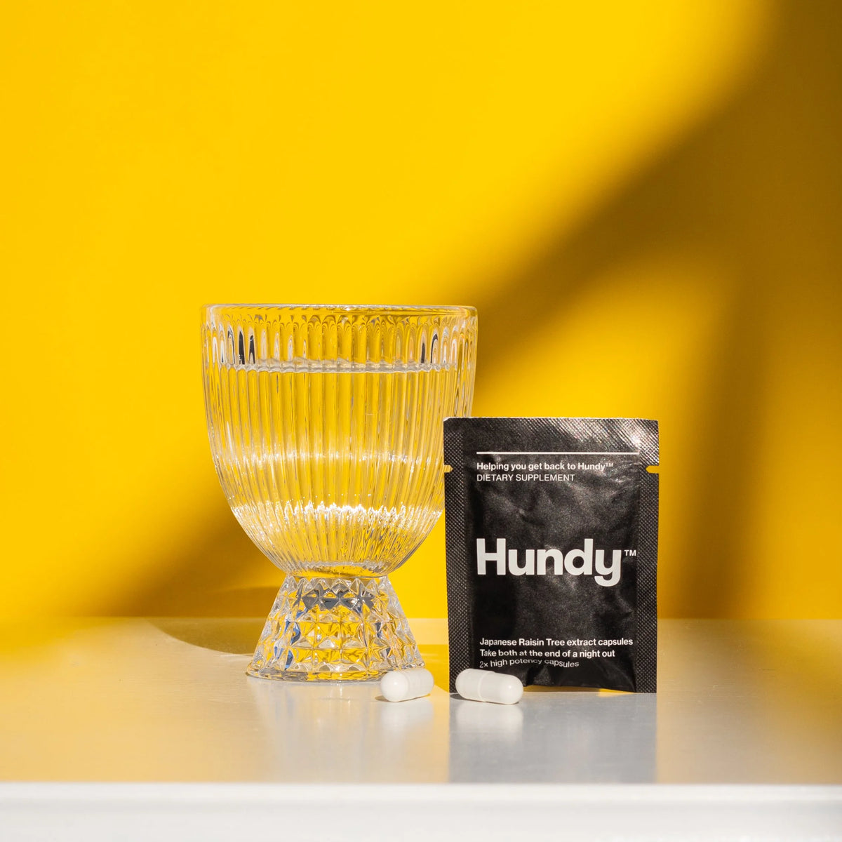 Hundy liver support sachet with two capsules and water